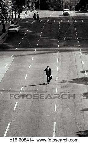Picture - Lone businessman downtown. Fotosearch