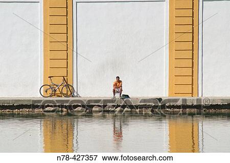 Lonely fisherman. Guadalquivir river. Sevilla. Andalucia. Spain. View Large Photo Image Stock Photo - Lonely fisherman. Guadalquivir river. Sevilla. Andalucia. Spain.. Fotosearch
