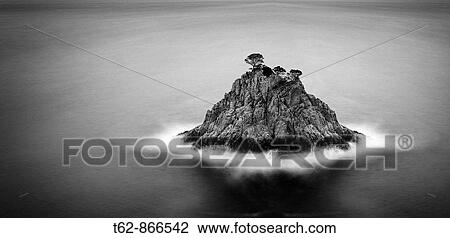 Stock Image - Lonely island in the Costa Brava, Catalonia, Spain. Fotosearch