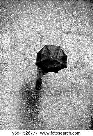 lonely man on the road, in rain View Large Photo Image Stock Photo - lonely man on the road, in rain. Fotosearch