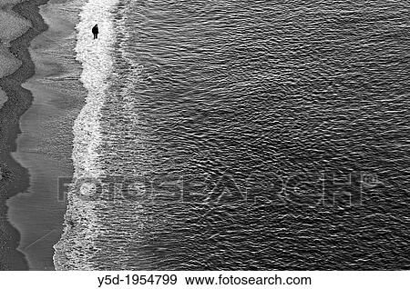 Lonely man walking in the water on the beach, Amalfi Coast, Italy, March View Large Photo Image Stock Photo - Lonely man walking in the water on the beach, Amalfi Coast, Italy, March. Fotosearch