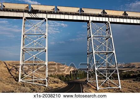 Long and high railroad tressle spans a river valley. View Large Photo Image Stock Image - Long and high railroad tressle spans a river valley.. Fotosearch