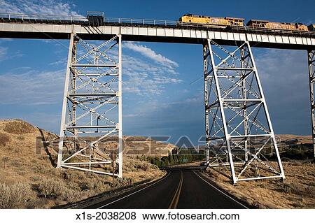 Long and high railroad tressle spans a river valley. View Large Photo Image Stock Photo - Long and high railroad tressle spans a river valley.. Fotosearch