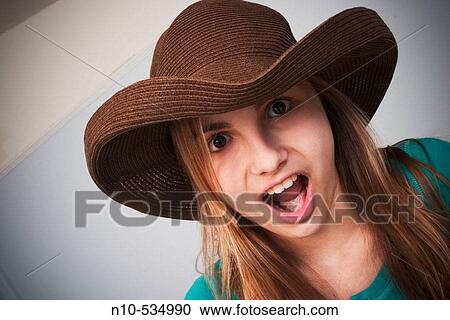 Long blond-hair teen girl wearing a hat View Large Photo Image Stock Image - Long blond-hair teen girl wearing a hat. Fotosearch