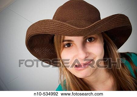 Long blond-hair teen girl wearing a hat View Large Photo Image Stock Image - Long blond-hair teen girl wearing a hat. Fotosearch