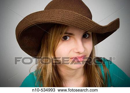 Long blond-hair teen girl wearing a hat View Large Photo Image Stock Image - Long blond-hair teen girl wearing a hat. Fotosearch