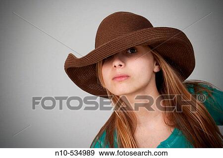 Stock Photo - Long blond-hair teen girl wearing a hat. Fotosearch