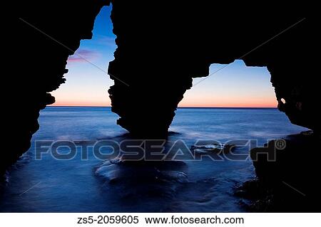 Long exposure from inside a cave with a nice sunrise infront and clear sky, in Benitatxell, Alicante, Comunidad Valenciana, Spain, Europe. View Large Photo Image Stock Photography - Long exposure from inside a cave with a nice sunrise infront and clear sky, in Benitatxell, Alicante, Comunidad Valenciana, Spain, Europe.. Fotosearch