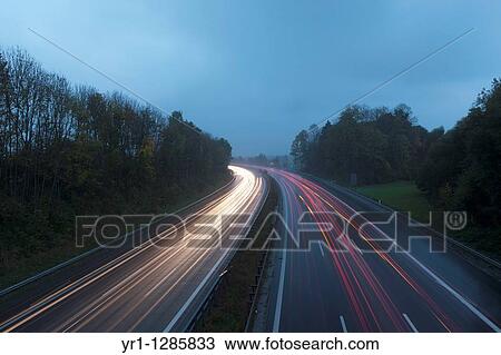 Long exposure of the german autobahn. Shot in bavaria at dusk blue hour. View Large Photo Image Stock Image - Long exposure of the german autobahn. Shot in bavaria at dusk blue hour.. Fotosearch
