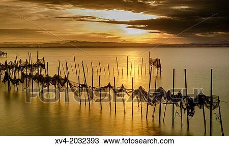 Long exposure shot at Gola de Pujol on Sunset, Albufera de Valencia, Spain. View Large Photo Image Stock Image - Long exposure shot at Gola de Pujol on Sunset, Albufera de Valencia, Spain.. Fotosearch