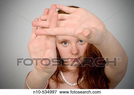 Long red-hair teen girl holding her hands View Large Photo Image Stock Photo - Long red-hair teen girl holding her hands. Fotosearch