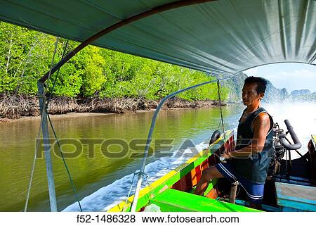 Long tail boat Phang Nga Bay, Andaman Sea, Thailand, Asia. View Large Photo Image Stock Photo - Long tail boat Phang Nga Bay, Andaman Sea, Thailand, Asia.. Fotosearch