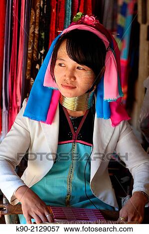 Longneck Karen woman sitting and weaving a pink scarf, Mae Hong Son, Thailand, Southeast Asia. View Large Photo Image Stock Photo - Longneck Karen woman sitting and weaving a pink scarf, Mae Hong Son, Thailand, Southeast Asia.. Fotosearch