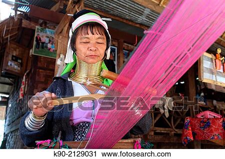 Longneck Karen woman sitting on the floor and weaving a pink scarf, Mae Hong Son, Thailand, Southeast Asia. View Large Photo Image Stock Image - Longneck Karen woman sitting on the floor and weaving a pink scarf, Mae Hong Son, Thailand, Southeast Asia.. Fotosearch