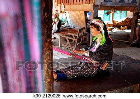 Longneck Karen woman sitting on the floor of her house and weaving a scarf, Mae Hong Son, Thailand, Southeast Asia. View Large Photo Image Stock Photograph - Longneck Karen woman sitting on the floor of her house and weaving a scarf, Mae Hong Son, Thailand, Southeast Asia.. Fotosearch