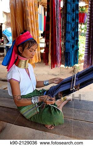 Longneck Karen woman sitting on the floor and weaving a pink scarf, Mae Hong Son, Thailand, Southeast Asia. View Large Photo Image Stock Photograph - Longneck Karen woman sitting on the floor and weaving a pink scarf, Mae Hong Son, Thailand, Southeast Asia.. Fotosearch