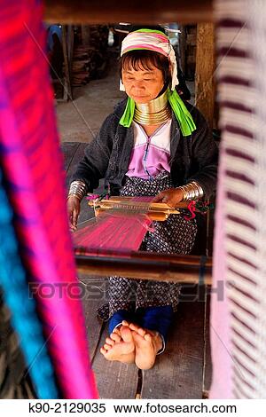 Longneck Karen woman sitting on the floor and weaving a pink scarf, Mae Hong Son, Thailand, Southeast Asia. View Large Photo Image Stock Photography - Longneck Karen woman sitting on the floor and weaving a pink scarf, Mae Hong Son, Thailand, Southeast Asia.. Fotosearch