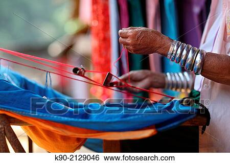 Longneck Karen woman weaving a scarf, Mae Hong Son, Thailand, Southeast Asia. View Large Photo Image Stock Photograph - Longneck Karen woman weaving a scarf, Mae Hong Son, Thailand, Southeast Asia.. Fotosearch