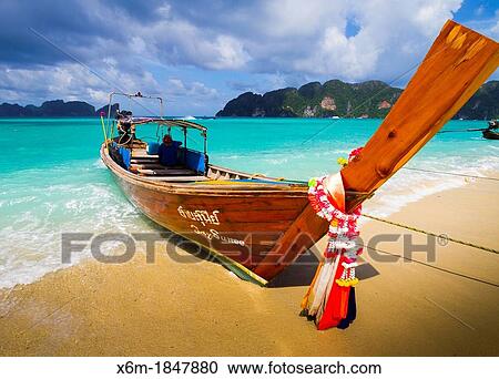 Longtail boat on Long beach Phi Phi Don island Krabi province, Andaman Sea, Thailand View Large Photo Image Stock Image - Longtail boat on Long beach Phi Phi Don island Krabi province, Andaman Sea, Thailand. Fotosearch