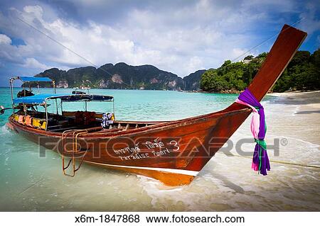 Longtail boat on Long beach Phi Phi Don island Krabi province, Andaman Sea, Thailand View Large Photo Image Stock Photo - Longtail boat on Long beach Phi Phi Don island Krabi province, Andaman Sea, Thailand. Fotosearch