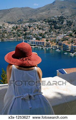 Stock Photo - Looking at the island town of Symi Greece. Fotosearch