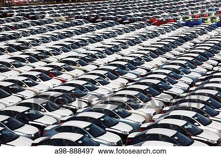 looking down close up on dockside storage of imported new cars awaiting distribution at the port of Paldiski, Tallinn, Estonia. View Large Photo Image Stock Photo - looking down close up on dockside storage of imported new cars awaiting distribution at the port of Paldiski, Tallinn, Estonia.. Fotosearch