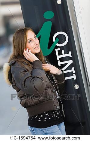 Picture - Looking for information young woman. Fotosearch