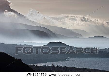 Looking south down the Messinian coast of the outer Mani on a misty morning with. View Large Photo Image Stock Photograph - Looking south down the Messinian coast of the outer Mani on a misty morning with.. Fotosearch