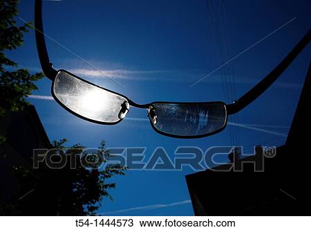 Looking through a pair of sunglasses in the sun View Large Photo Image Stock Image - Looking through a pair of sunglasses in the sun. Fotosearch