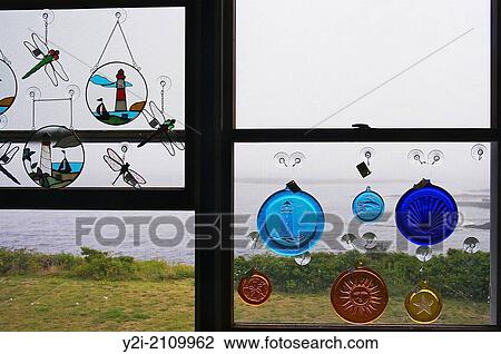 Looking towards the ocean throw a window decorated with glass ornaments at the Land's End gift shop, Harpswell, Maine. View Large Photo Image Stock Image - Looking towards the ocean throw a window decorated with glass ornaments at the Land's End gift shop, Harpswell, Maine.. Fotosearch