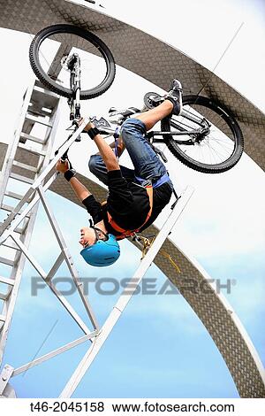 Looping Bike circular ramp with help of this mountain bike and a harness can be given one or more turns of 360 degrees depending on the speed of the pedals. View Large Photo Image Stock Photo - Looping Bike circular ramp with help of this mountain bike and a harness can be given one or more turns of 360 degrees depending on the speed of the pedals.. Fotosearch