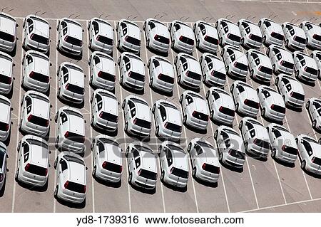 Lot of new cars in the industrial port of Valencia, Spain, Europe View Large Photo Image Stock Photograph - Lot of new cars in the industrial port of Valencia, Spain, Europe. Fotosearch