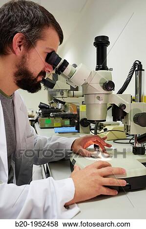 Stock Photo - Loupe. Analysis of causes of failure of components and systems. Technological Services to Industry. Tecnalia Research & Innovation, Donostia, San Sebastian, Gipuzkoa, Basque Country, Spain.. Fotosearch