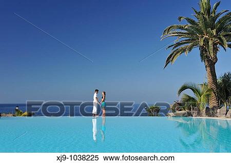 Love face to face with infinity pool reflection View Large Photo Image Stock Photography - Love face to face with infinity pool reflection. Fotosearch