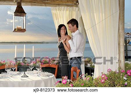 Lovers who dine on the lagoon after the storm. View Large Photo Image Stock Image - Lovers who dine on the lagoon after the storm.. Fotosearch