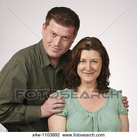 Loving married heterosexual couple posing for portrait View Large Photo Image Stock Image - Loving married heterosexual couple posing for portrait. Fotosearch