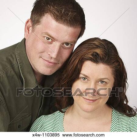 Loving married heterosexual couple posing for portrait View Large Photo Image Stock Photography - Loving married heterosexual couple posing for portrait. Fotosearch