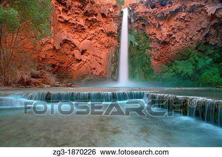 Low angle view in the Grand Canyon as Mooney Falls drop into turquoise pool, USA, Arizonal View Large Photo Image Stock Photograph - Low angle view in the Grand Canyon as Mooney Falls drop into turquoise pool, USA, Arizonal. Fotosearch