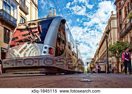 Low angle view of a streetcar, Constitution Avenue, Seville, Spain View Large Photo Image Stock Photography - Low angle view of a streetcar, Constitution Avenue, Seville, Spain. Fotosearch