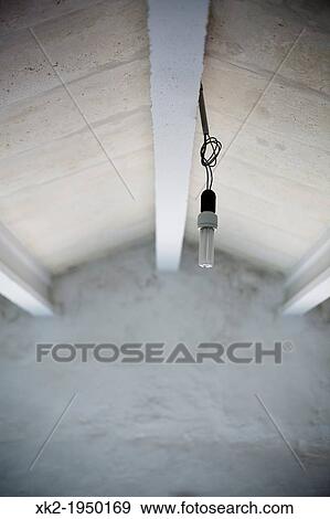 Low energy light bulb, awfull installation View Large Photo Image Stock Photo - Low energy light bulb, awfull installation. Fotosearch