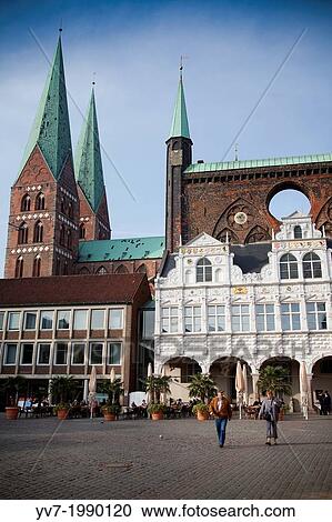 Lubeck Market Square with its town hall and the Church of St. Mary in the background. Lubeck, Schleswig-Holstein, Germany. View Large Photo Image Stock Image - Lubeck Market Square with its town hall and the Church of St. Mary in the background. Lubeck, Schleswig-Holstein, Germany.. Fotosearch