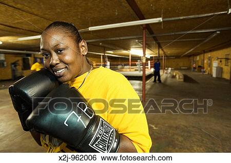 Lumberton, North Carolina--Alberta Palmer poses for the camera before a workout at Blackmon's Boxing Palmer is an organizer for the United Food and Commercial Workers union View Large Photo Image Stock Photograph - Lumberton, North Carolina--Alberta Palmer poses for the camera before a workout at Blackmon's Boxing Palmer is an organizer for the United Food and Commercial Workers union. Fotosearch