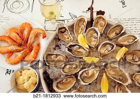 Lunch on the Bassin d? Arcachon: shrimps with mayonnaise, oysters and white wine from Gascogne, Gironde, Aquitaine, France View Large Photo Image Stock Image - Lunch on the Bassin d? Arcachon: shrimps with mayonnaise, oysters and white wine from Gascogne, Gironde, Aquitaine, France. Fotosearch
