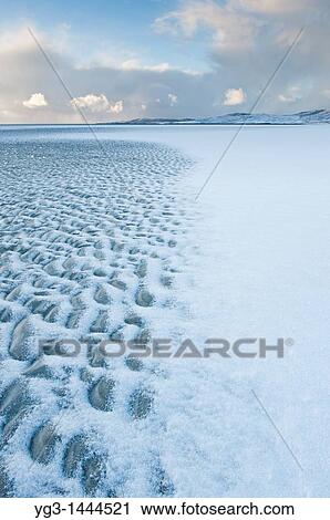 Stock Image - Luskentyre beach with dusting of snow, Isle of Harris, Outer Hebrides, Scotland. Fotosearch