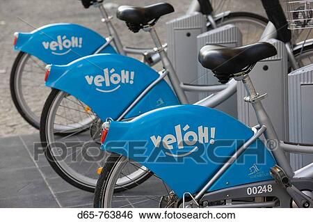 Stock Photograph - Luxembourg, Luxembourg City, Place Guillaume II, Vel? oh rental bicycles (bicycle sharing system). Fotosearch