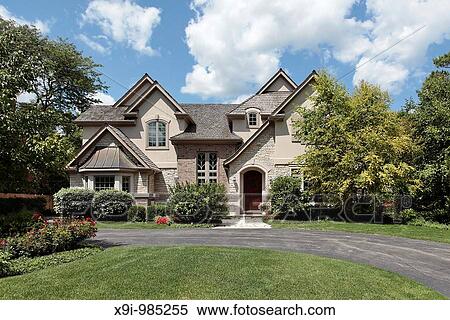Luxury brick and stone home with arched entry View Large Photo Image Stock Photography - Luxury brick and stone home with arched entry. Fotosearch