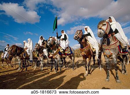 Stock Image - Lybian riders International Festival of the Sahara Douz Southern Tunisia.. Fotosearch