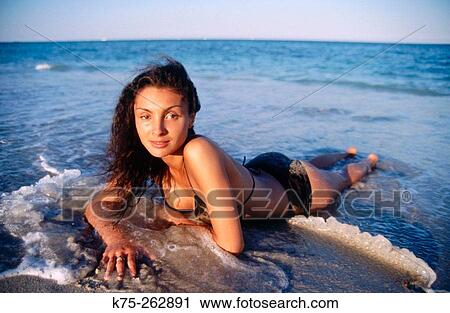 Lying in the surf View Large Photo Image Stock Image - Lying in the surf. Fotosearch