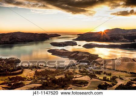 Lyttelton harbour at dawn from Summit road above Christchurch, Canterbury, New Zealand View Large Photo Image Stock Image - Lyttelton harbour at dawn from Summit road above Christchurch, Canterbury, New Zealand. Fotosearch