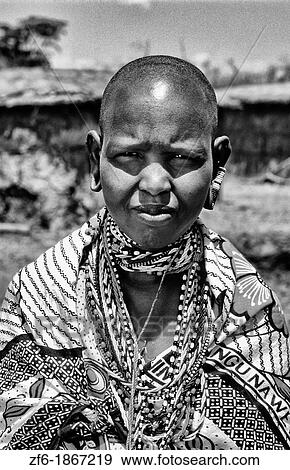 Maasai tribe dark woman in costume traditional dress in jungles near Kenya Africa View Large Photo Image Stock Photo - Maasai tribe dark woman in costume traditional dress in jungles near Kenya Africa. Fotosearch